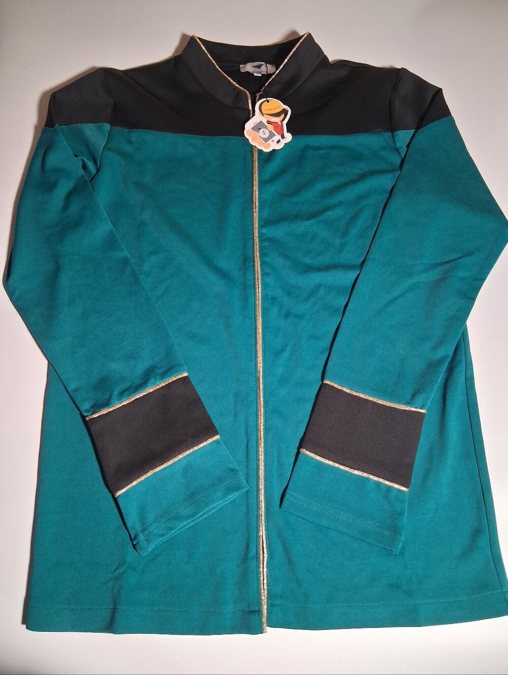 THE NEXT GENERATION. Teal Zip Front Jacket with Black Accents